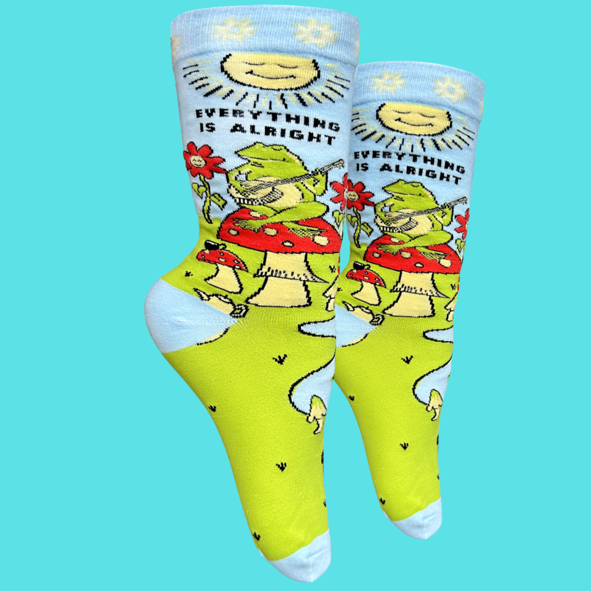 Everything Is Alright Socks. A pair of Socks depicting a blissed out frog sat on a magic mushroom. Bright blue toes, heels and cuffs.