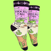 A pair of socks with a frog and desert motif with the slogan F**k All Y'all on the ankle. Black toes, heel and cuff.