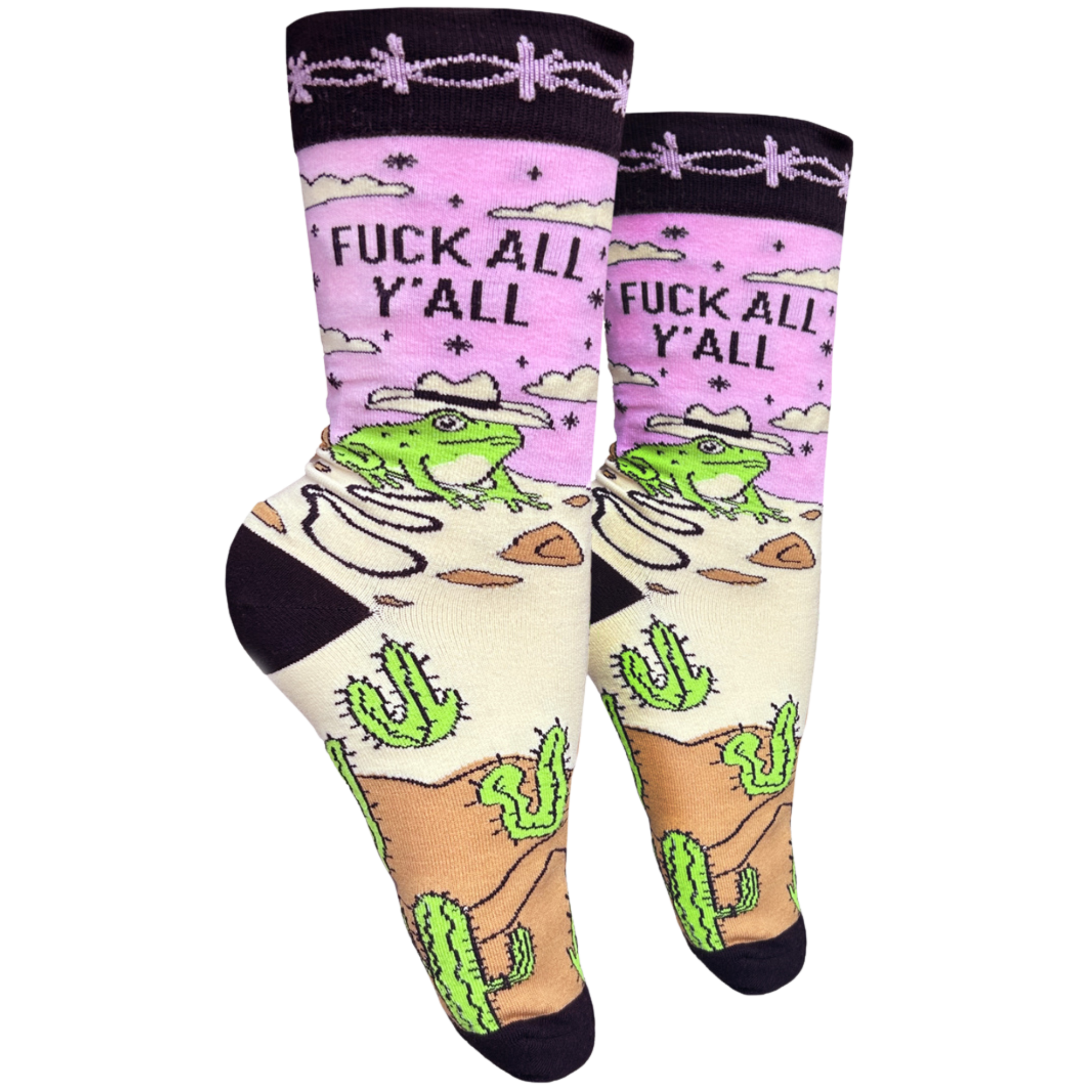 A pair of socks with a frog and desert motif with the slogan F**k All Y'all on the ankle. Black toes, heel and cuff. 