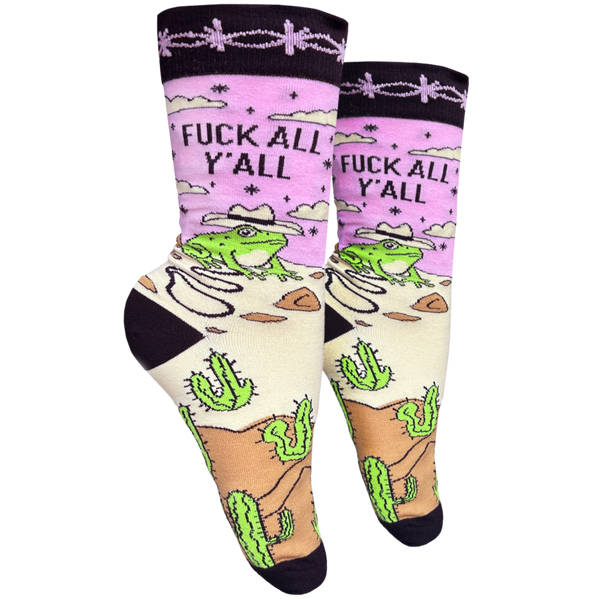A pair of socks with a frog and desert motif with the slogan F**k All Y'all on the ankle. Black toes, heel and cuff. 