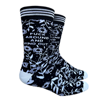 F**k Around and Find Out Socks. A pair of bold floral and slogan socks with black legs and light blue toes, cuff and heel. 