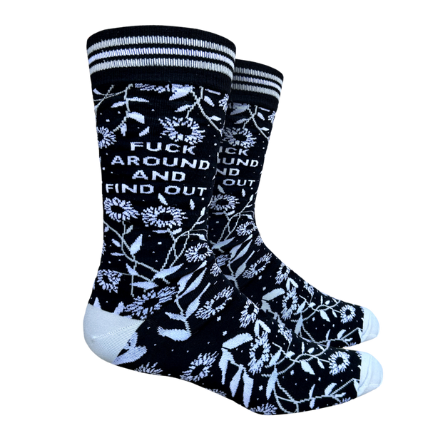 F**k Around and Find Out Socks. A pair of bold floral and slogan socks with black legs and light blue toes, cuff and heel. 