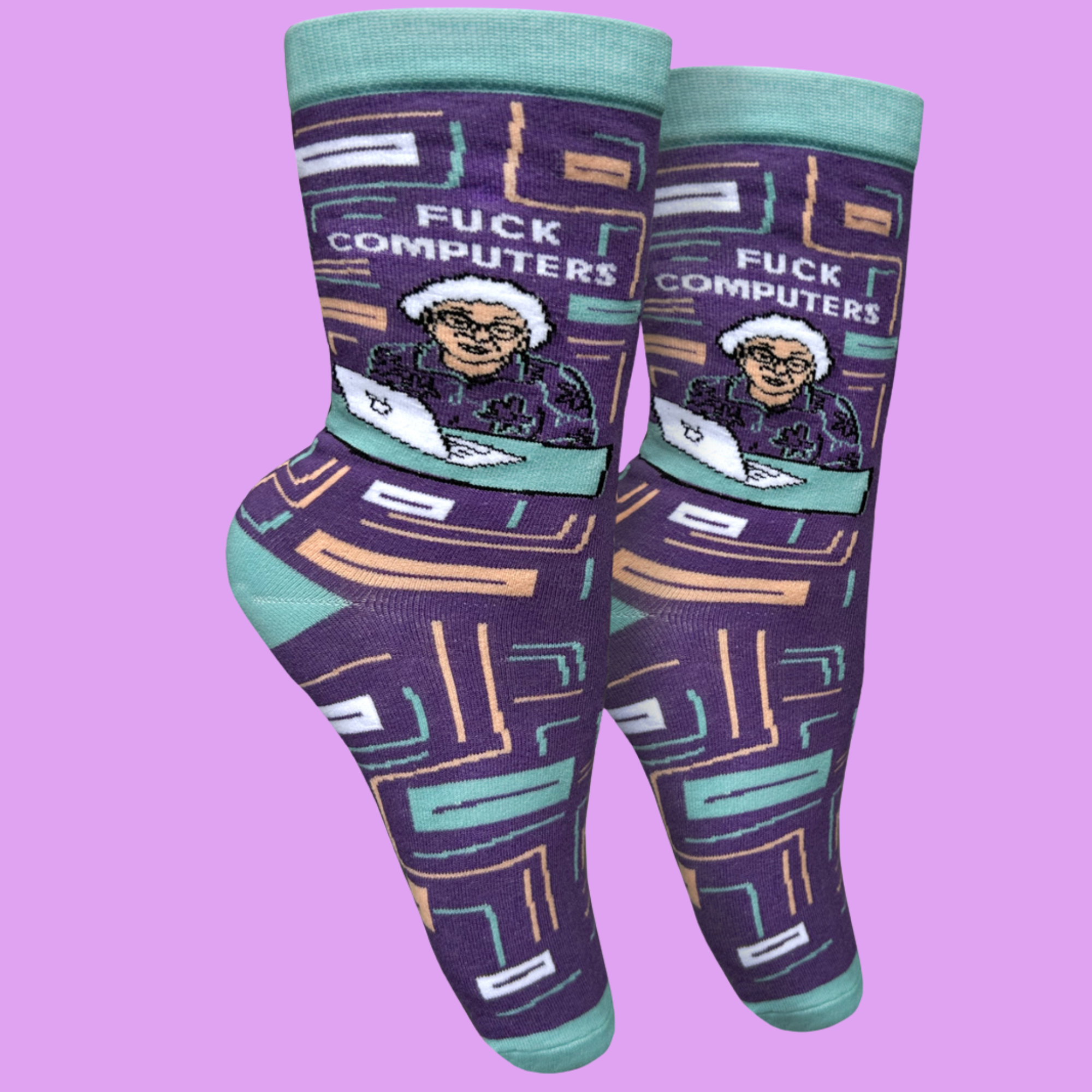 A paie of socks with a bold sweary slogan and a cool peach and purple design. Teal toes, heel and cuff.