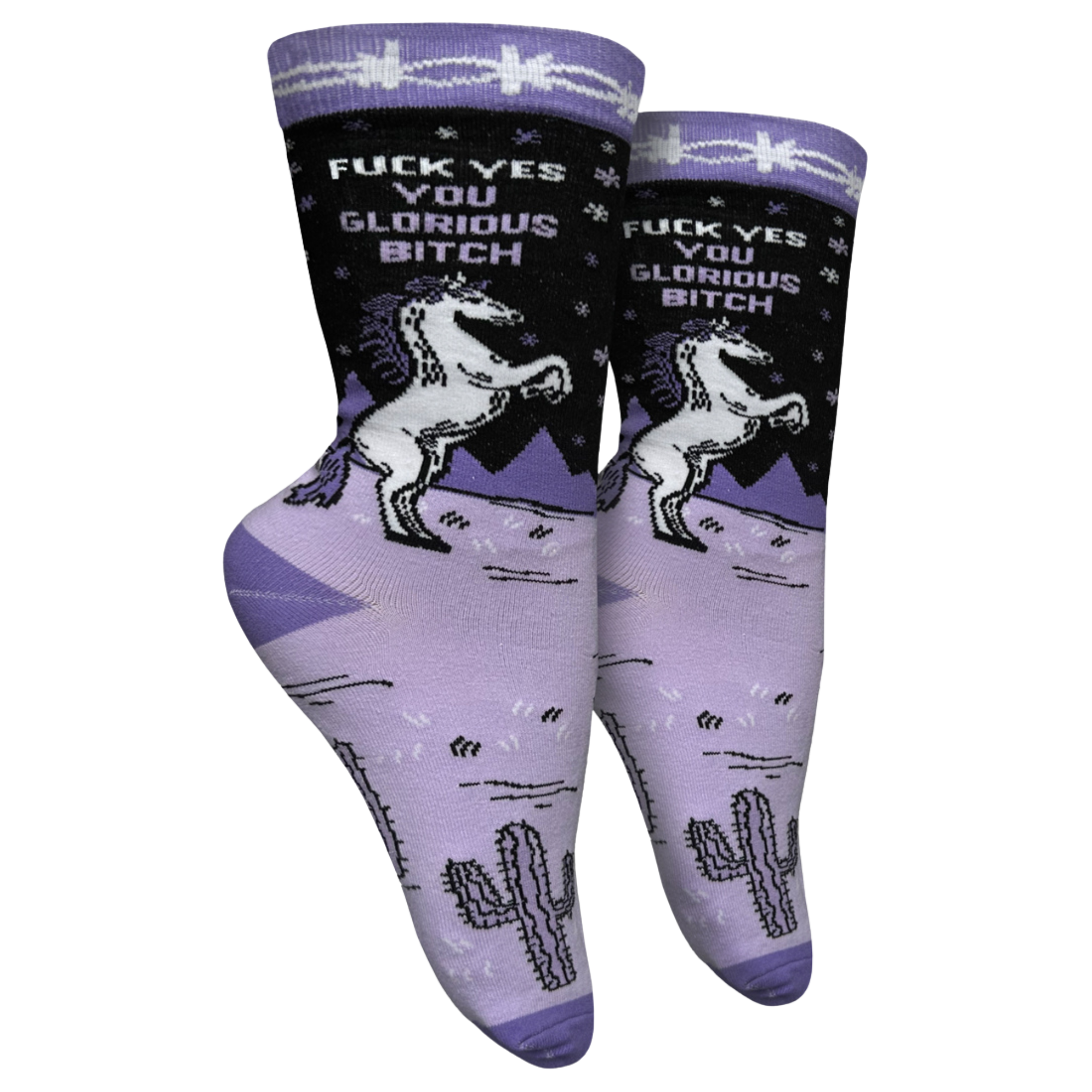 F**k Yes You Glorious B**ch Socks - Small. A pair of socks with a unicorn motif and a bold sweary slogan. Purple legs with deep purple toes, heel and cuff. 