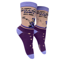 Give a S**t Fairy Socks. A pair of socks with a bold slogan and a fairy design. Purple feet and light purple toe, hell and cuff.