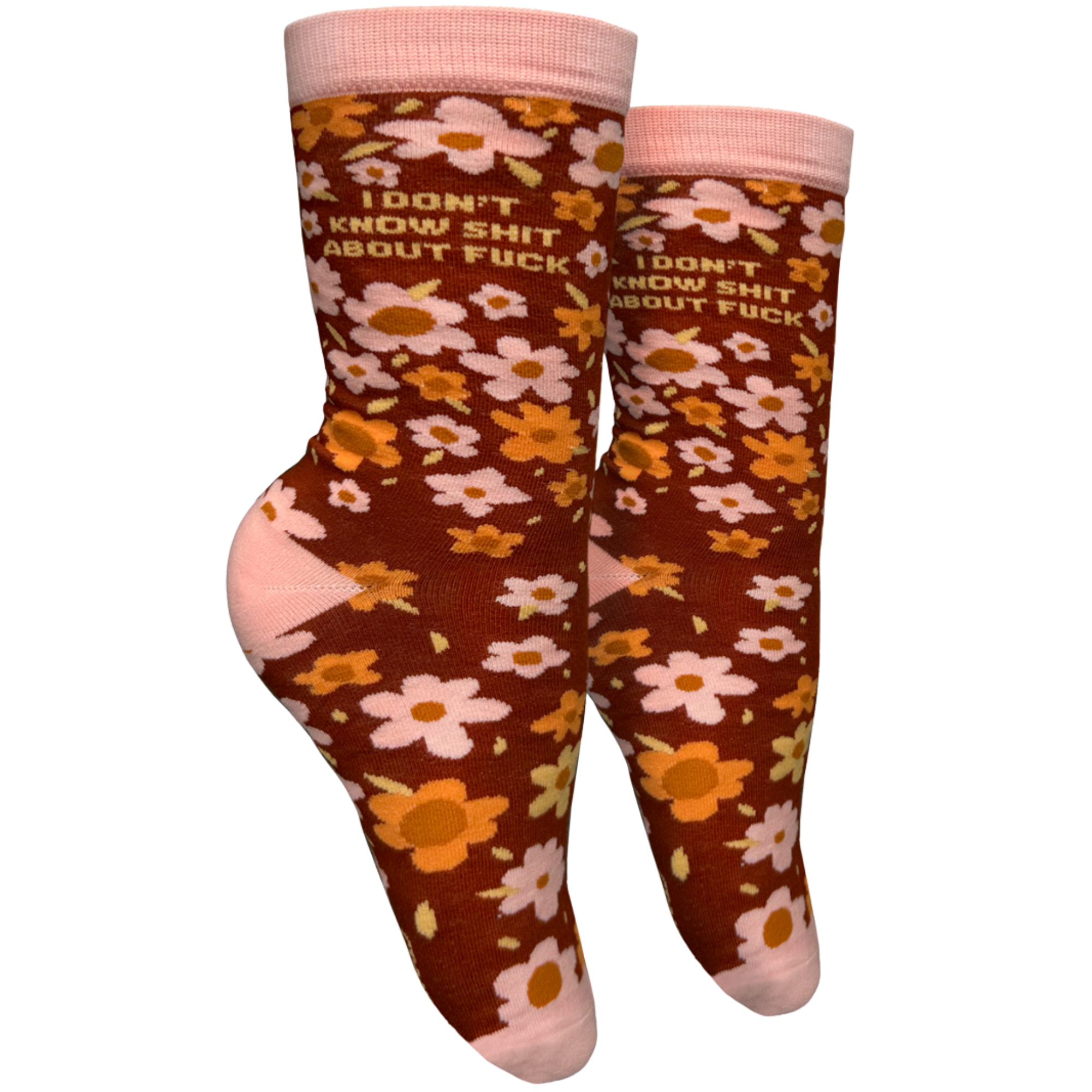 I Don't Know S**t About F**k Socks - Small. A pair of socks with a bold sweary slogan and a bold flowers design. Pink toes, hell and cuff. 