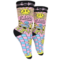 I'm A Ray Of F**king Sunshine Socks - Small. A pair of socks with a psychedelic sun shine pattern in bright blue and pink. Black toes, heel and cuff.