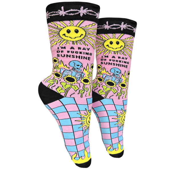 I'm A Ray Of F**king Sunshine Socks - Small. A pair of socks with a psychedelic sun shine pattern in bright blue and pink. Black toes, heel and cuff.