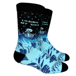 Losing My S**t Socks. A blue and black pair of socks with a skeleton and the slogan Losing My S**t on the ankle. Black heel, toe and cuff.