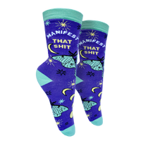 Manifest That S**t Socks. A pair of socks with the slogan Manifest That S**t and a butterfly motif. Purple ankles, turquoise toe, heel and cuff. 