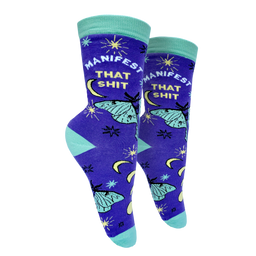 Manifest That S**t Socks. A pair of socks with the slogan Manifest That S**t and a butterfly motif. Purple ankles, turquoise toe, heel and cuff. 
