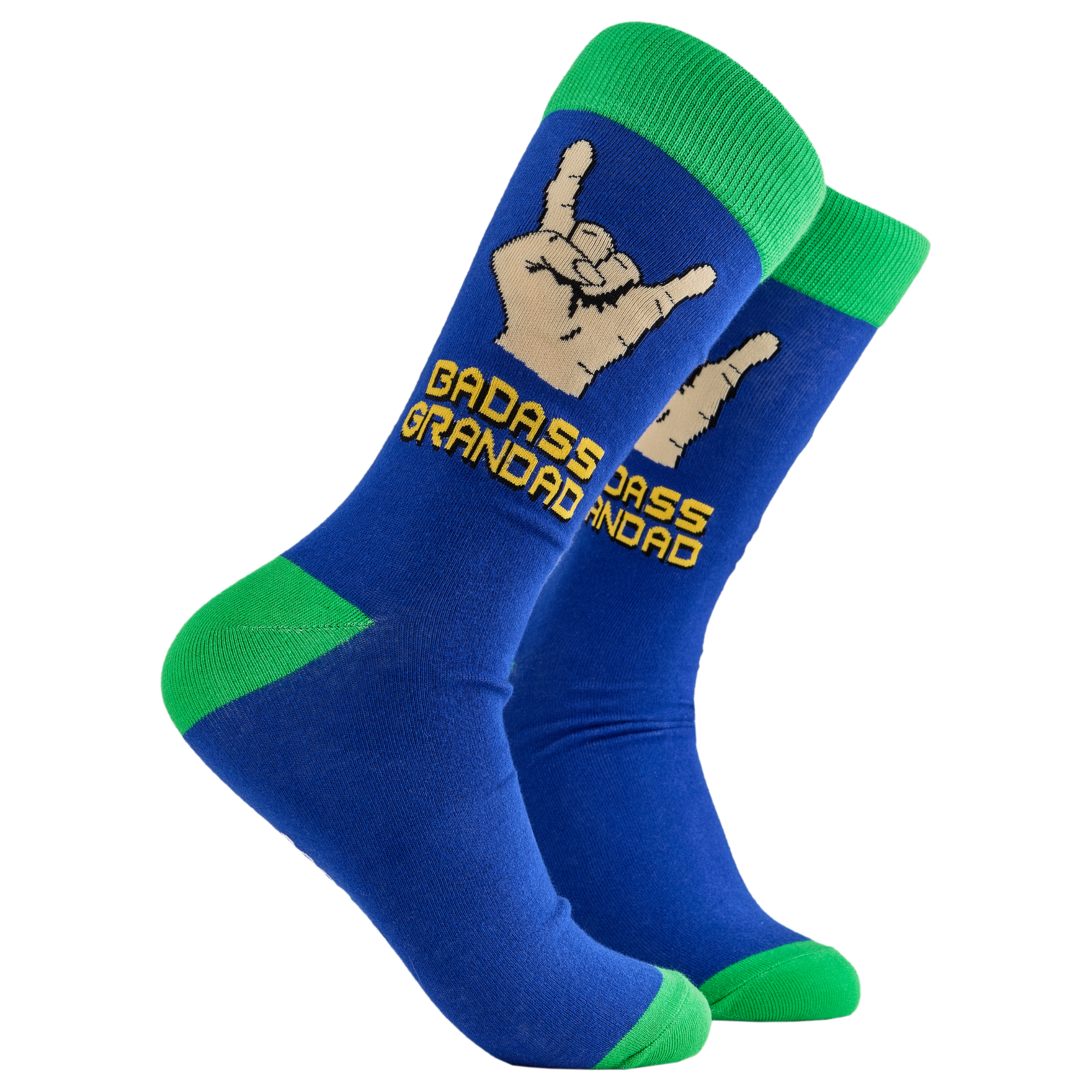 A pair of socks depicting metal horns that say 'Badass Grandad. Blue legs, green cuff, heel and toe. 
